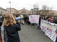 French students protest with employees of the French state owned railway company SNCF during a demonstration in front of the Gare de l’Est t...