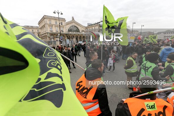 Employee of the French state owned railway company SNCF wearing union jackets and holding flags demonstrate in front of the Gare de L'Est tr...