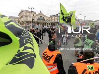 Employee of the French state owned railway company SNCF wearing union jackets and holding flags demonstrate in front of the Gare de L'Est tr...