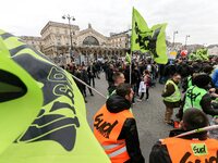 Employee of the French state owned railway company SNCF wearing union jackets and holding flags demonstrate in front of the Gare de L'Est tr...