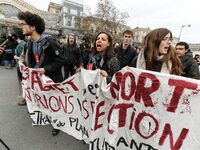 French students protest with employees of the French state owned railway company SNCF during a demonstration in front of the Gare de l’Est t...