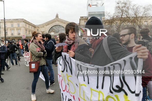 French students protest with employees of the French state owned railway company SNCF during a demonstration in front of the Gare de l’Est t...