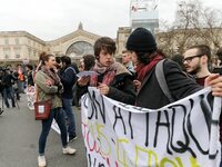 French students protest with employees of the French state owned railway company SNCF during a demonstration in front of the Gare de l’Est t...