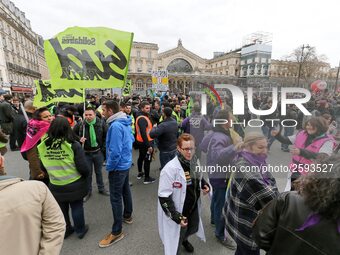 Employees of the French state owned railway company SNCF demonstrate in front of the Gare de L'Est train station on April 3, 2018 in Paris,...