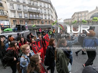 French students protest with employees of the French state owned railway company SNCF during a demonstration in front of the Gare de l’Est t...