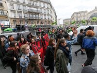 French students protest with employees of the French state owned railway company SNCF during a demonstration in front of the Gare de l’Est t...