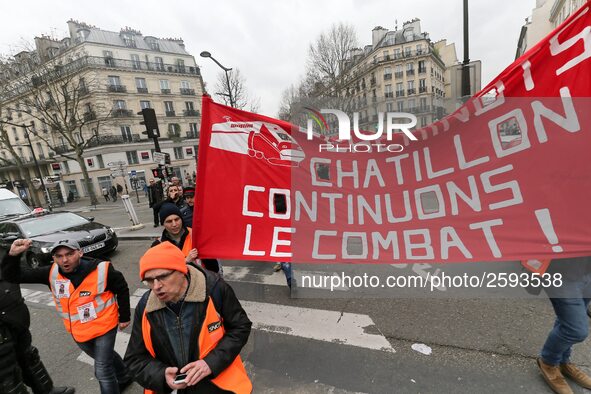 Employees of the French state owned railway company SNCF wearing union jackets and holding a banner demonstrate in front of the Gare de L'Es...