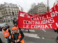 Employees of the French state owned railway company SNCF wearing union jackets and holding a banner demonstrate in front of the Gare de L'Es...