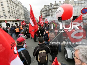 Employees of the French state owned railway company SNCF wearing union jackets and holding a banner demonstrate in front of the Gare de L'Es...