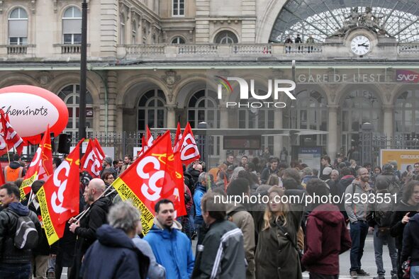 Employee of the French state owned railway company SNCF holding flags demonstrate in front of the Gare de L'Est train station on April 3, 20...