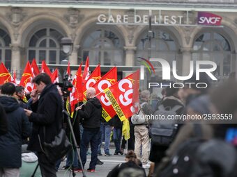 Employee of the French state owned railway company SNCF holding flags demonstrate in front of the Gare de L'Est train station on April 3, 20...