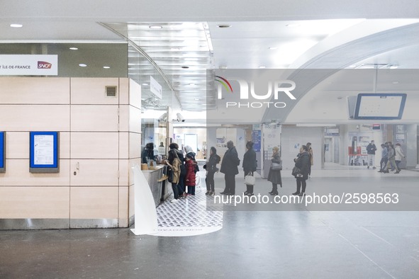 People are queing in front of a SNCF office in order to learn more the cancelations of trains of the day. Trade unions decided to launch a 1...