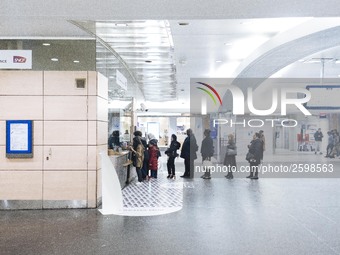 People are queing in front of a SNCF office in order to learn more the cancelations of trains of the day. Trade unions decided to launch a 1...