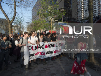 Students hold a banner reading "Tolbiac mobilized same Macron, same fight!" as they gather in front of the Paris Tolbiac university campus o...