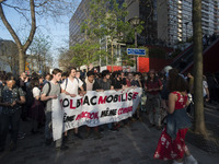 Students hold a banner reading "Tolbiac mobilized same Macron, same fight!" as they gather in front of the Paris Tolbiac university campus o...