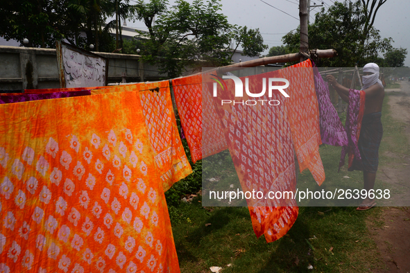 Bangladeshi labors working in the Batik Cloth industry at Narsingdi area near Dhaka, Bangladesh, on April 26, 2018. Each Worker earns par da...