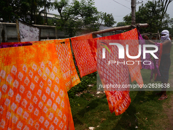 Bangladeshi labors working in the Batik Cloth industry at Narsingdi area near Dhaka, Bangladesh, on April 26, 2018. Each Worker earns par da...