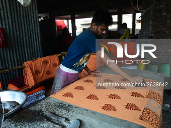 Bangladeshi labors working in the Batik Cloth industry at Narsingdi area near Dhaka, Bangladesh, on April 26, 2018. Each Worker earns par da...