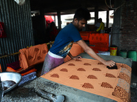 Bangladeshi labors working in the Batik Cloth industry at Narsingdi area near Dhaka, Bangladesh, on April 26, 2018. Each Worker earns par da...