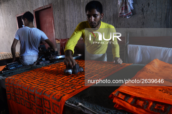 Bangladeshi labors working in the Batik Cloth industry at Narsingdi area near Dhaka, Bangladesh, on April 26, 2018. Each Worker earns par da...