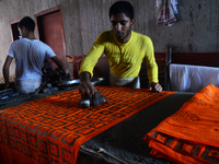 Bangladeshi labors working in the Batik Cloth industry at Narsingdi area near Dhaka, Bangladesh, on April 26, 2018. Each Worker earns par da...