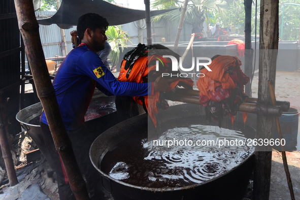 Bangladeshi labors working in the Batik Cloth industry at Narsingdi area near Dhaka, Bangladesh, on April 26, 2018. Each Worker earns par da...