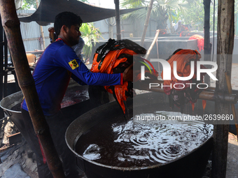 Bangladeshi labors working in the Batik Cloth industry at Narsingdi area near Dhaka, Bangladesh, on April 26, 2018. Each Worker earns par da...