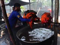 Bangladeshi labors working in the Batik Cloth industry at Narsingdi area near Dhaka, Bangladesh, on April 26, 2018. Each Worker earns par da...