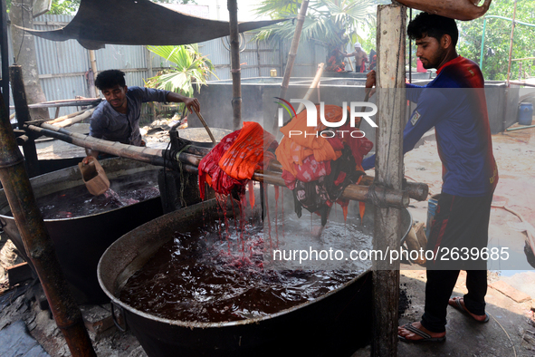 Bangladeshi labors working in the Batik Cloth industry at Narsingdi area near Dhaka, Bangladesh, on April 26, 2018. Each Worker earns par da...