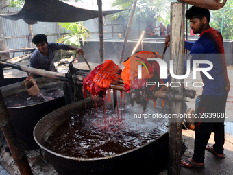 Bangladeshi labors working in the Batik Cloth industry at Narsingdi area near Dhaka, Bangladesh, on April 26, 2018. Each Worker earns par da...