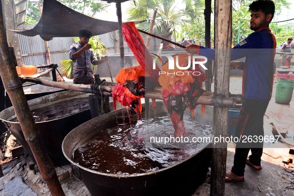 Bangladeshi labors working in the Batik Cloth industry at Narsingdi area near Dhaka, Bangladesh, on April 26, 2018. Each Worker earns par da...