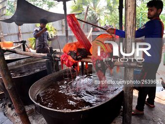 Bangladeshi labors working in the Batik Cloth industry at Narsingdi area near Dhaka, Bangladesh, on April 26, 2018. Each Worker earns par da...