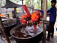 Bangladeshi labors working in the Batik Cloth industry at Narsingdi area near Dhaka, Bangladesh, on April 26, 2018. Each Worker earns par da...