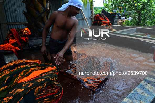 Bangladeshi labors working in the Batik Cloth industry at Narsingdi area near Dhaka, Bangladesh, on April 26, 2018. Each Worker earns par da...