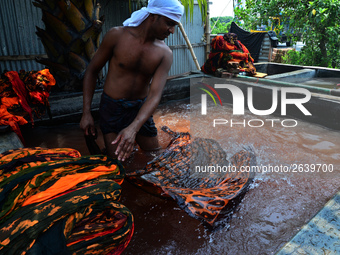 Bangladeshi labors working in the Batik Cloth industry at Narsingdi area near Dhaka, Bangladesh, on April 26, 2018. Each Worker earns par da...