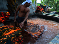 Bangladeshi labors working in the Batik Cloth industry at Narsingdi area near Dhaka, Bangladesh, on April 26, 2018. Each Worker earns par da...