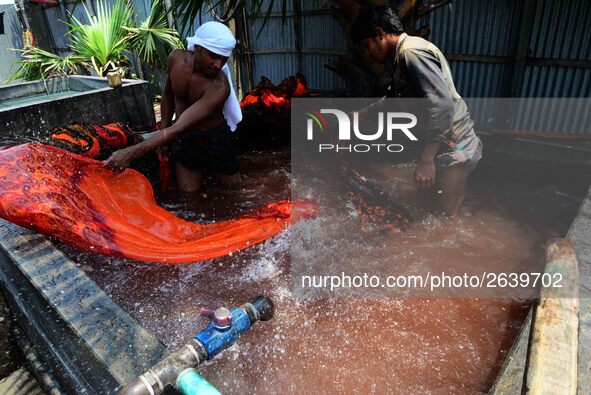 Bangladeshi labors working in the Batik Cloth industry at Narsingdi area near Dhaka, Bangladesh, on April 26, 2018. Each Worker earns par da...