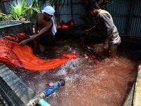 Bangladeshi labors working in the Batik Cloth industry at Narsingdi area near Dhaka, Bangladesh, on April 26, 2018. Each Worker earns par da...