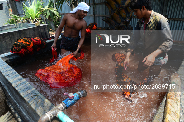 Bangladeshi labors working in the Batik Cloth industry at Narsingdi area near Dhaka, Bangladesh, on April 26, 2018. Each Worker earns par da...