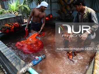 Bangladeshi labors working in the Batik Cloth industry at Narsingdi area near Dhaka, Bangladesh, on April 26, 2018. Each Worker earns par da...