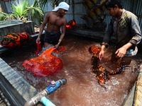 Bangladeshi labors working in the Batik Cloth industry at Narsingdi area near Dhaka, Bangladesh, on April 26, 2018. Each Worker earns par da...