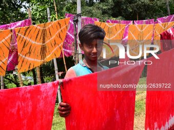 Bangladeshi labors working in the Batik Cloth industry at Narsingdi area near Dhaka, Bangladesh, on April 26, 2018. Each Worker earns par da...