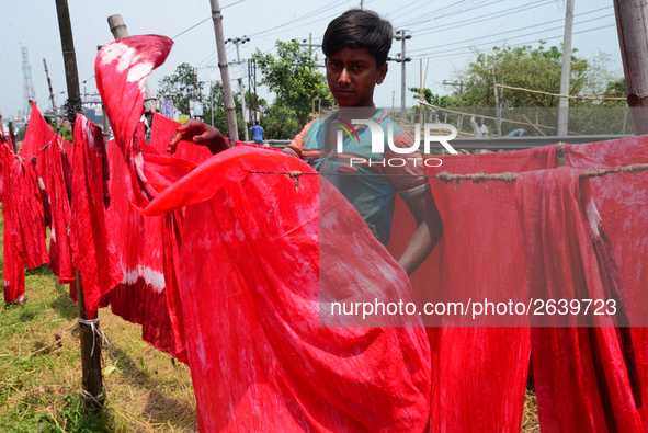 Bangladeshi labors working in the Batik Cloth industry at Narsingdi area near Dhaka, Bangladesh, on April 26, 2018. Each Worker earns par da...