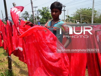 Bangladeshi labors working in the Batik Cloth industry at Narsingdi area near Dhaka, Bangladesh, on April 26, 2018. Each Worker earns par da...