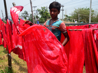 Bangladeshi labors working in the Batik Cloth industry at Narsingdi area near Dhaka, Bangladesh, on April 26, 2018. Each Worker earns par da...