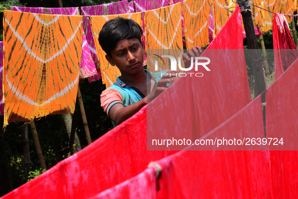 Bangladeshi labors working in the Batik Cloth industry at Narsingdi area near Dhaka, Bangladesh, on April 26, 2018. Each Worker earns par da...