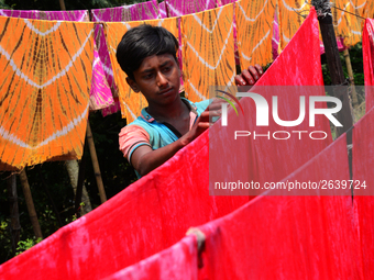 Bangladeshi labors working in the Batik Cloth industry at Narsingdi area near Dhaka, Bangladesh, on April 26, 2018. Each Worker earns par da...