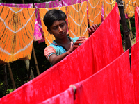 Bangladeshi labors working in the Batik Cloth industry at Narsingdi area near Dhaka, Bangladesh, on April 26, 2018. Each Worker earns par da...