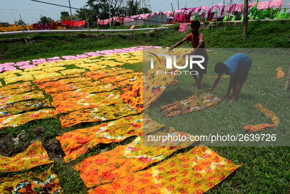 Bangladeshi labors working in the Batik Cloth industry at Narsingdi area near Dhaka, Bangladesh, on April 26, 2018. Each Worker earns par da...