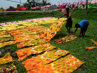 Bangladeshi labors working in the Batik Cloth industry at Narsingdi area near Dhaka, Bangladesh, on April 26, 2018. Each Worker earns par da...